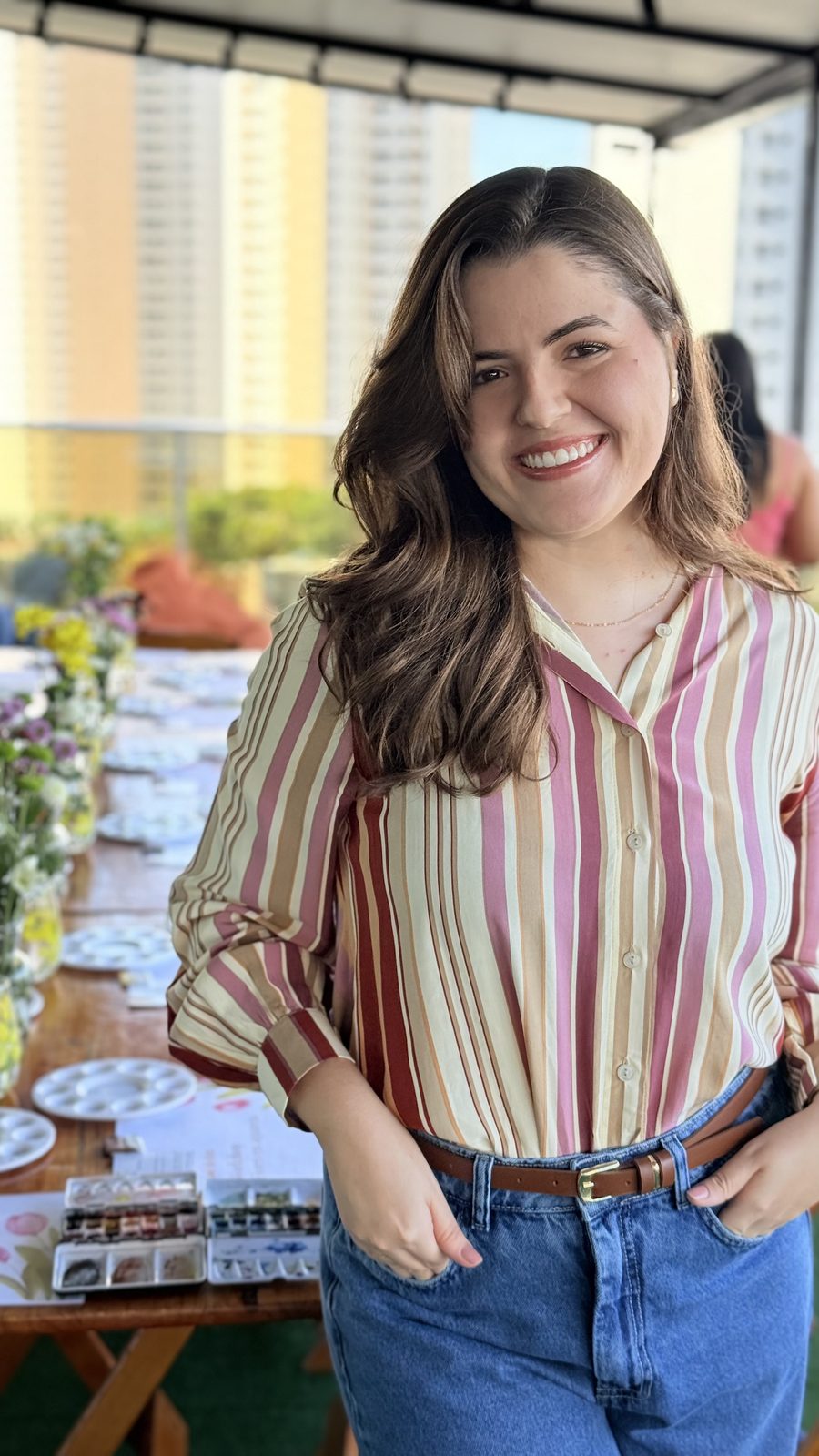 Ana sorrindo na primeira turma do workshop