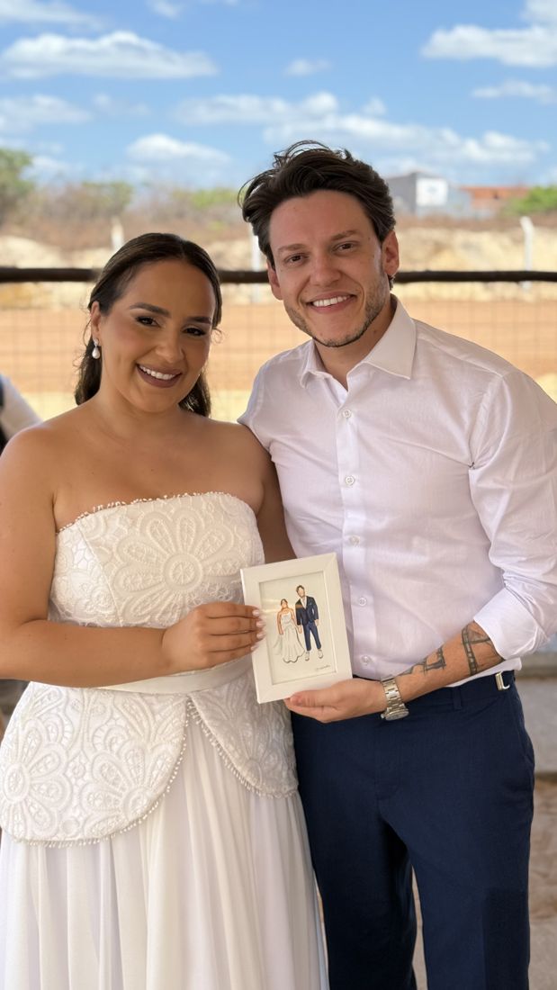 Casal com o retrato pintado ao vivo