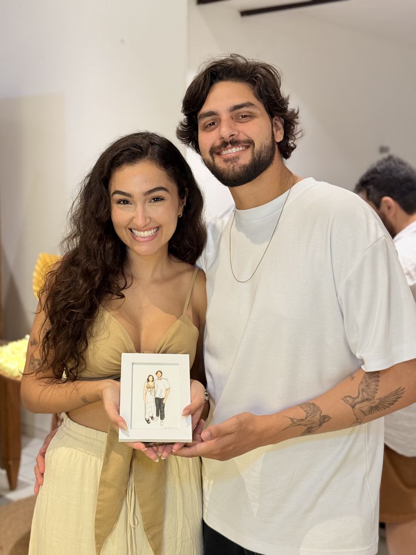 Casal com o retrato pintado ao vivo